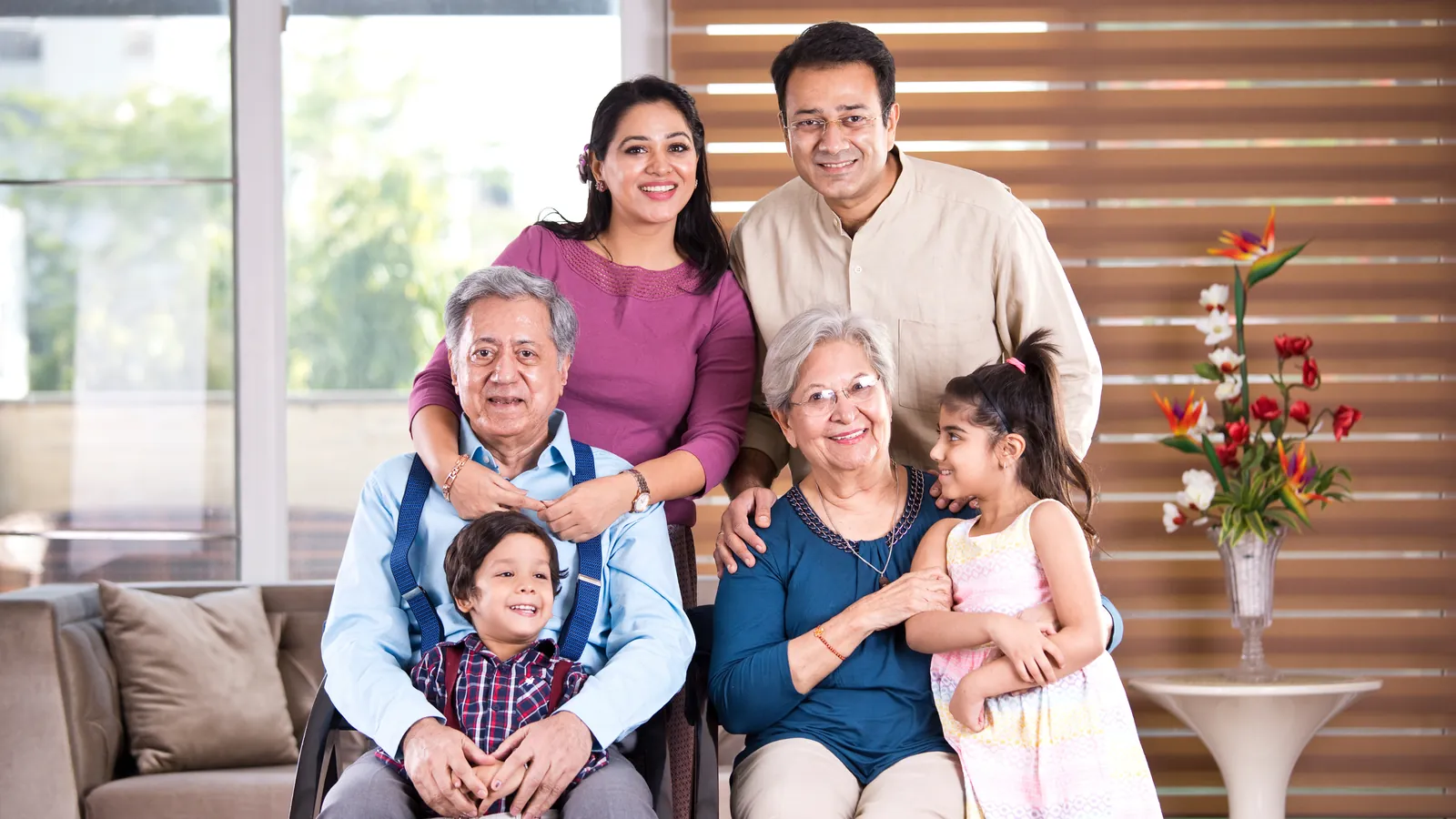 Three generations of a family gathered at home